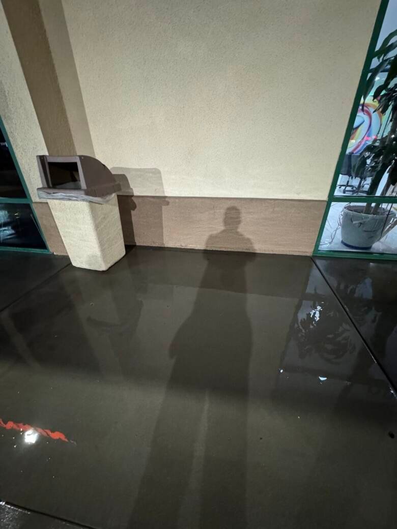 Freshly cleaned commercial entry floor reflecting overhead light
