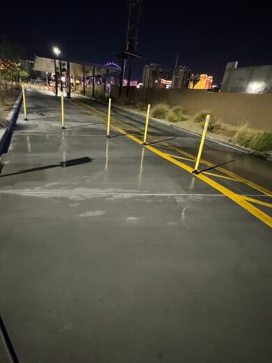 Drive Thru Pressure Washing Las Vegas Freshly cleaned drive-thru lane at night with the Las Vegas skyline behind it