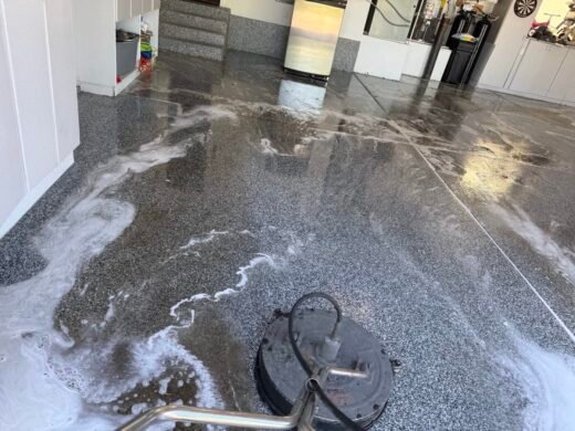 Epoxy Garage Floor Cleaning Las Vegas Epoxy-coated garage floor being cleaned with a surface cleaner and detergent