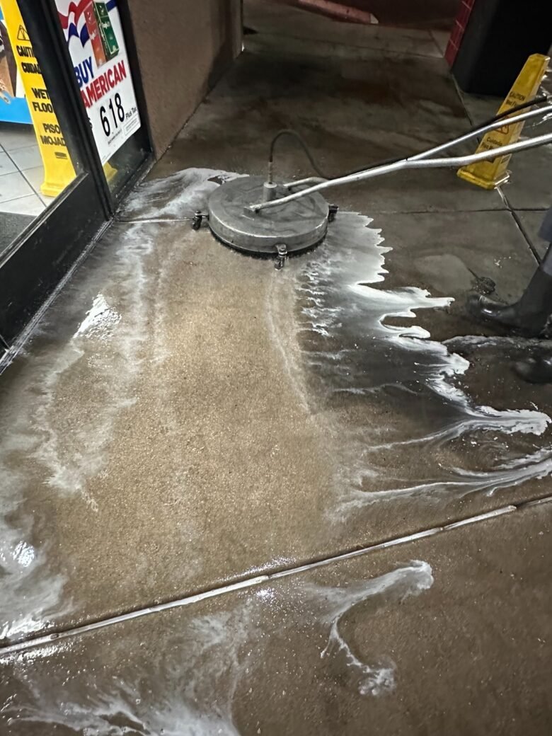 Surface cleaner and detergent foam on the concrete at a convenience store entrance