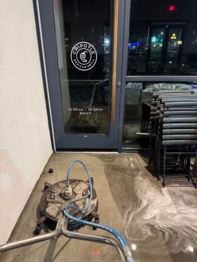 Restaurant Pressure Washing Las Vegas Restaurant entrance being cleaned at night with a surface cleaner and detergent