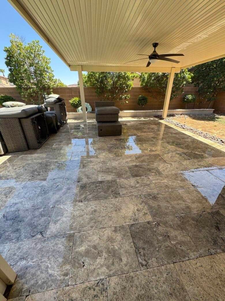 Clean travertine patio under a covered patio cover in a Las Vegas backyard